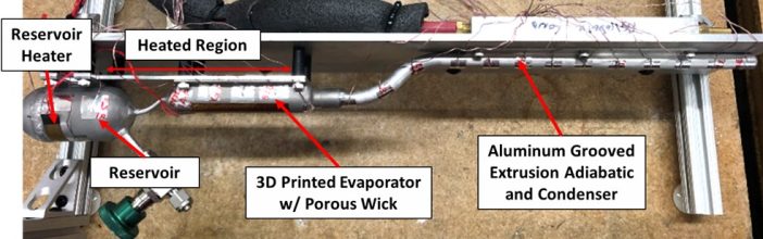 Figure 2. Non-Integrated Warm-Reservoir VCHP designed to operate on Astrobotic’s Lunar Lander Peregrine 1. The evaporator envelope and porous wick were 3D printed and interfaced with the axial grooves in the adiabatic and condenser section. The envelope material was aluminum and the working fluid was ammonia.