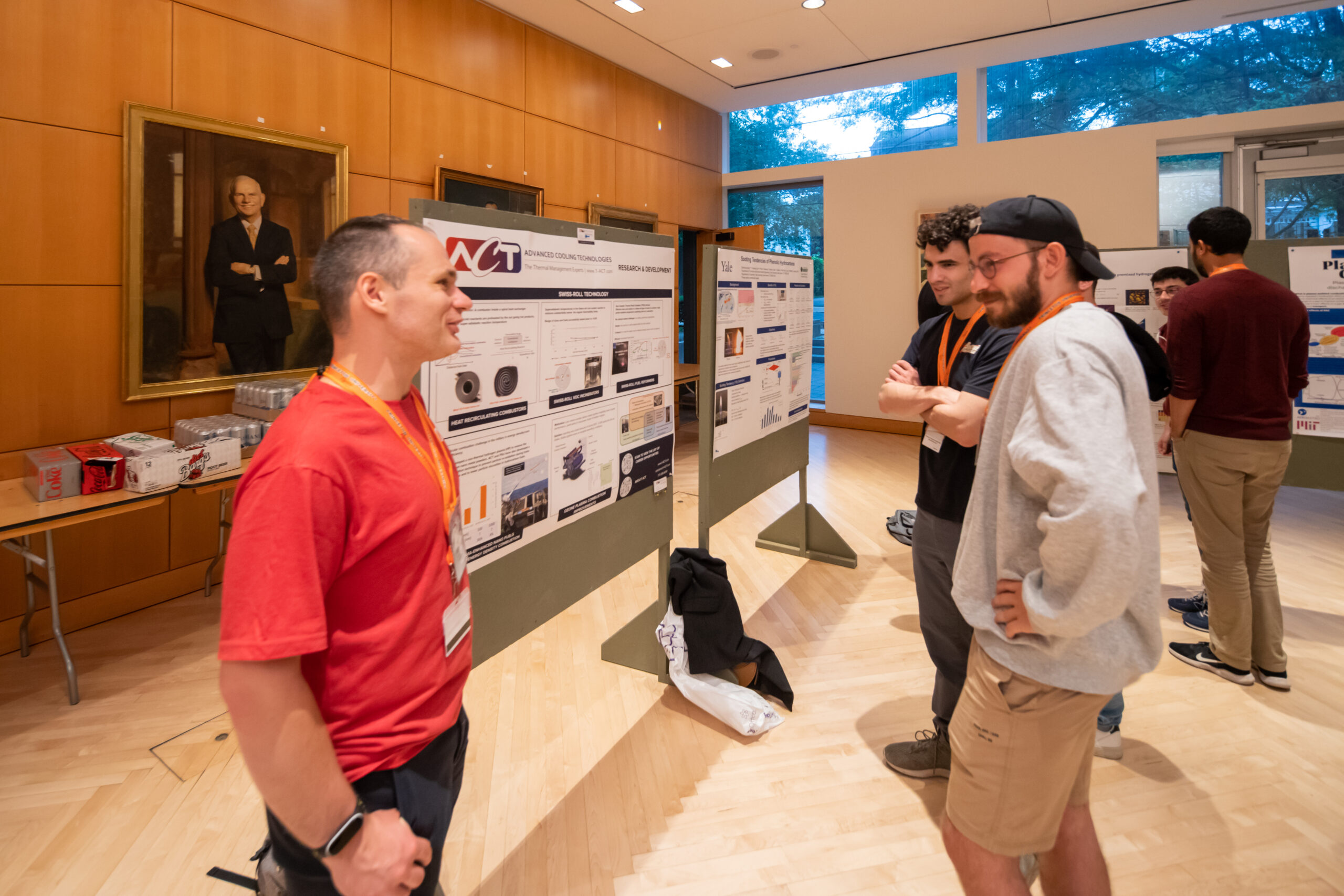 Patryk presenting on combustion research at ACT during a poster session