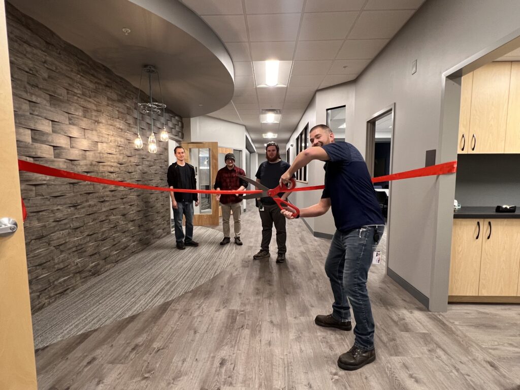 ACT's Facility Manager, Jordan Tingley cuts the ribbon, marking the official opening of the new space!