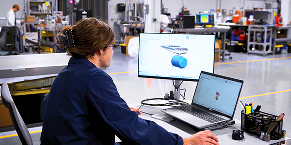 Engineering technician working on a computer